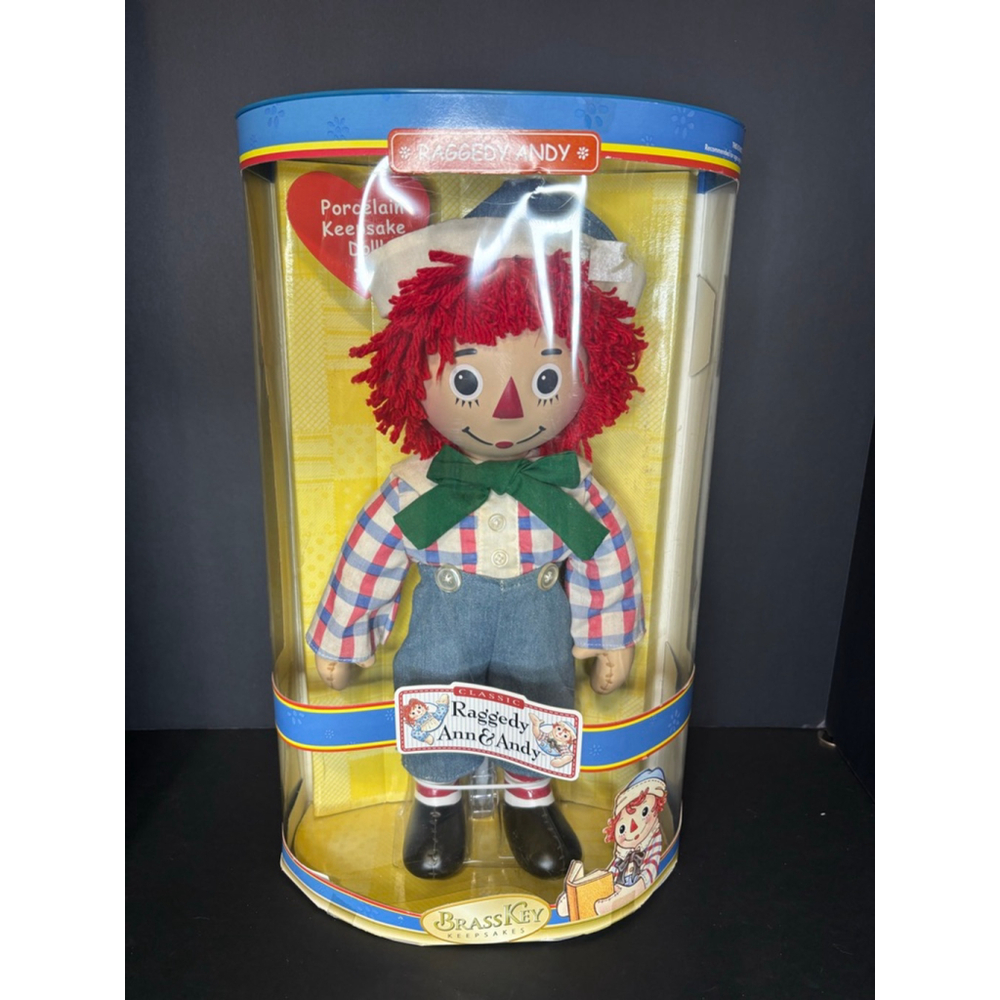 Raggedy Andy Doll new in box brass key porcelain doll